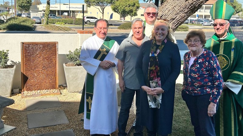 Left to right: Deacon Frank Gonzalez, Joe Montanez, Father David Loftus, pastor of Our Lady of Refuge Church, Dr. Heather Banis, coordinator for the archdiocese’s Victims Assistance Ministry, Marge Graf, general counsel for the Archdiocese of Los Angeles, and Auxiliary Bishop Marc Trudeau pose in front of the new healing garden at Our Lady of Refuge on Nov. 17. (Mike Cisneros)