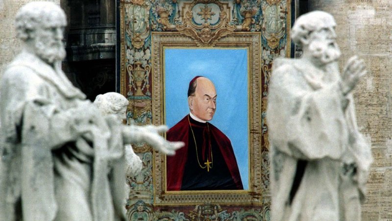 The image of Hungarian Bishop Vilmos Apor hangs from the central facade of St. Peter’s Basilica during his beatification at the Vatican in 1997. (CNS/ Reuters)