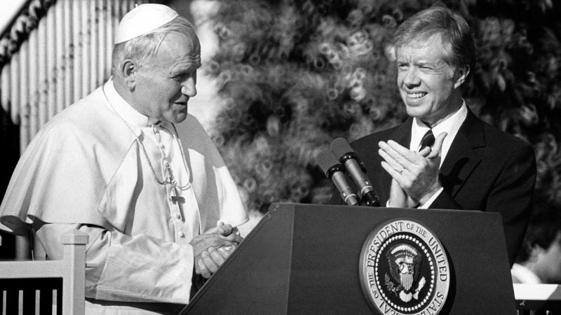 Pope John Paul II greets members of the U.S. Supreme Court on the north lawn of the White House Oct. 5, 1979, as President Jimmy Carter applauds. While in Washington, the pope expressed support for the second Strategic Arms Limitation Treaty, known as SALT II, at a time when U.S. bishops were voicing condemnation of nuclear proliferation. The pontiff also called on South American governments to respect the rights of their citizens in a speech to the Organization of American States and affirmed life during a Mass on the Mall. (CNS file photo) (May 22, 2003) (b/w only)