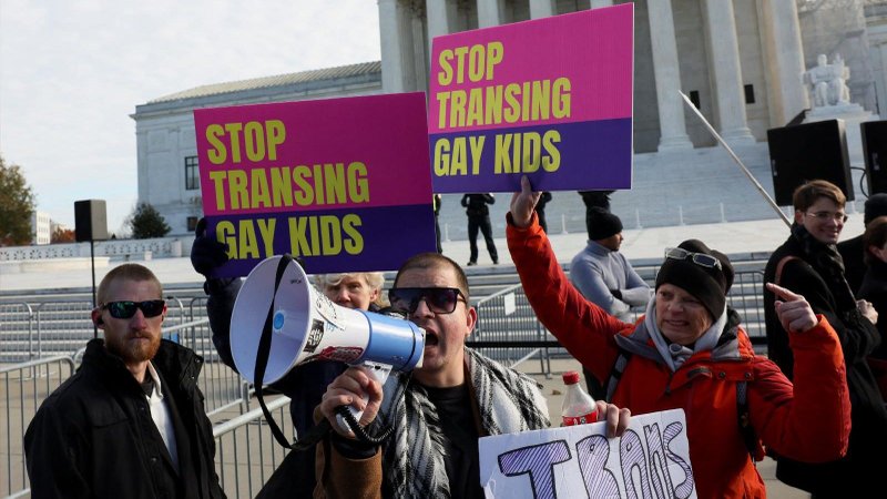 Protesters gather outside the U.S. Supreme Court in Washington, D.C., Dec. 4, as the justices heard arguments over an appeal by U.S. President Joe Biden’s administration of a lower court’s decision upholding a ban in Tennessee on so-called “gender-affirming medical care" for minors.(OSV News/Leah Millis, Reuters)