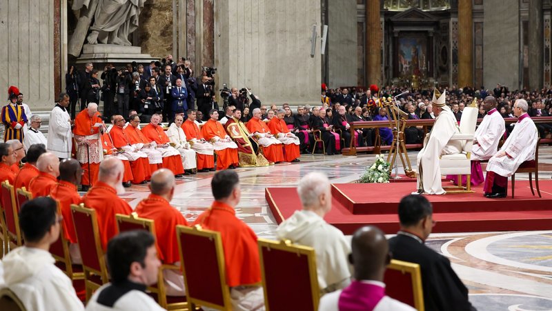 Pope Francis listens as Cardinal Angelo Acerbi, a 99-year-old retired Vatican diplomat, thanks him on behalf of the 21 new cardinals created at a consistory Dec. 7, 2024, in St. Peter's Basilica at the Vatican (CNS photo/Lola Gomez)
