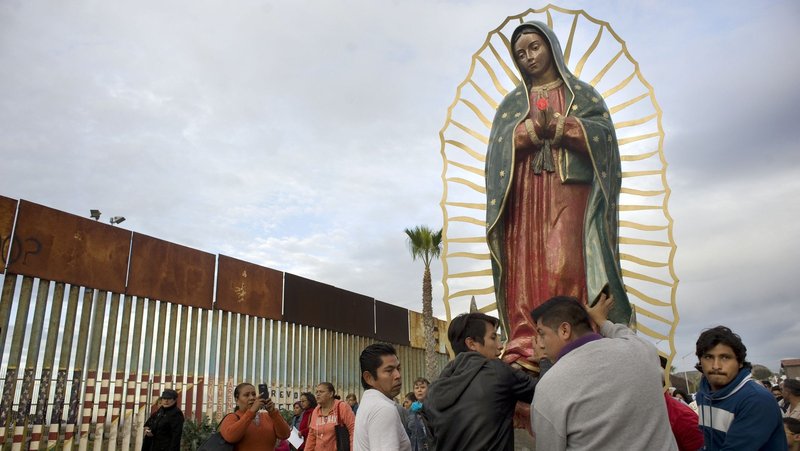 A file photo shows a statue of Our Lady of Guadalupe as it is unloaded from a truck after a procession to the U.S.-Mexico border fence in Tijuana, Mexico. (OSV News/David Maung)
