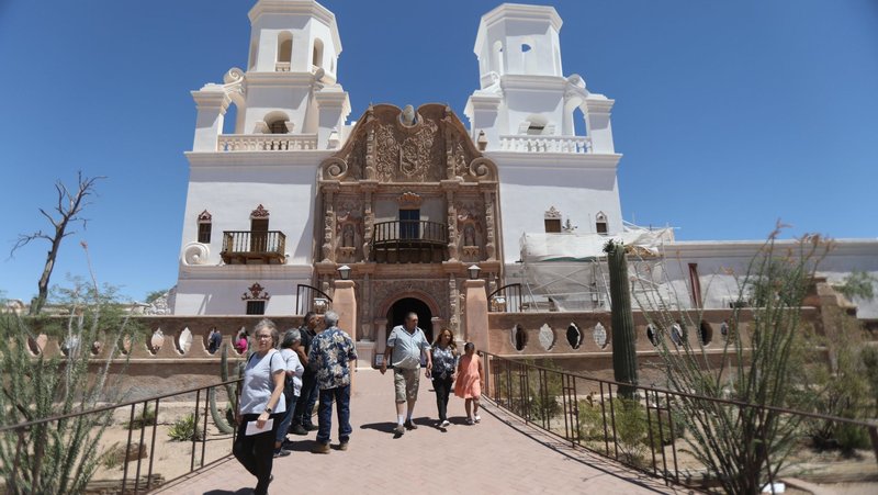 After attending Mass, people leave San Xavier del Bac Mission in Pima County, Ariz., outside Tucson, May 28, 2023. Ten state faith leaders -- including Catholic Bishops Edward J. Weisenburger of Tucson and John P. Dolan of Phoenix -- wrote an op-ed column published Dec. 28, 2024, in the Arizona Republic, denouncing reported proposals to allow immigration raids on churches, houses of worship, hospitals, schools and other locations currently deemed off-limits due to their sensitive nature once President-elect Donald Trump takes office. (OSV News photo/Bob Roller)