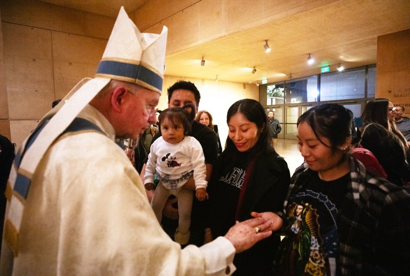 Archbishop José H. Gomez blesses items following the Las Mañanitas vigil celebrating Our Lady of Guadalupe on Dec. 11, 2024. (Victor Alemán)