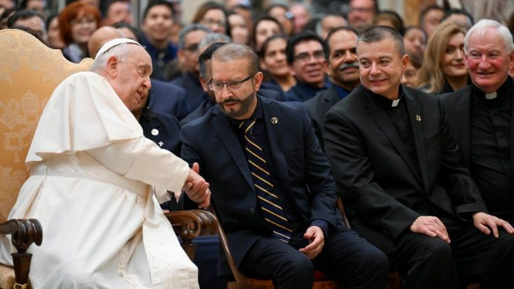 Pope Francis shakes Noel Díaz’s hand while Father Mario Torres, right, pastor of St. Thomas the Apostle Church in Los Angeles, and Father Jarlath “Jay” Cunnane, far right, pastor at St. Cornelius Church in Long Beach, look on. (Vatican Media)