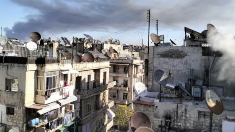Smoke of war rises over a residential area in Aleppo. On Dec. 1, 2024, the Franciscan complex of the Terra Santa College in Aleppo was hit by a strike. No casualties were reported. (ACI MENA via CNA)