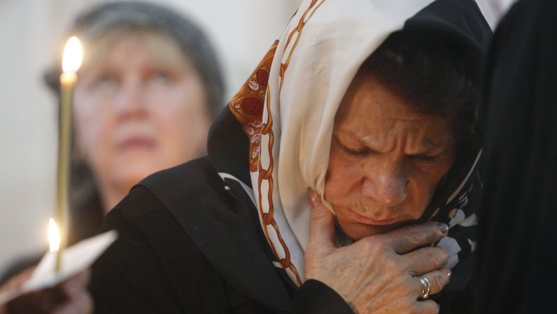 A woman is pictured in a file photo praying during an Orthodox service in Moscow. (OSV News photo/Sergei Karpukhin, Reuters)