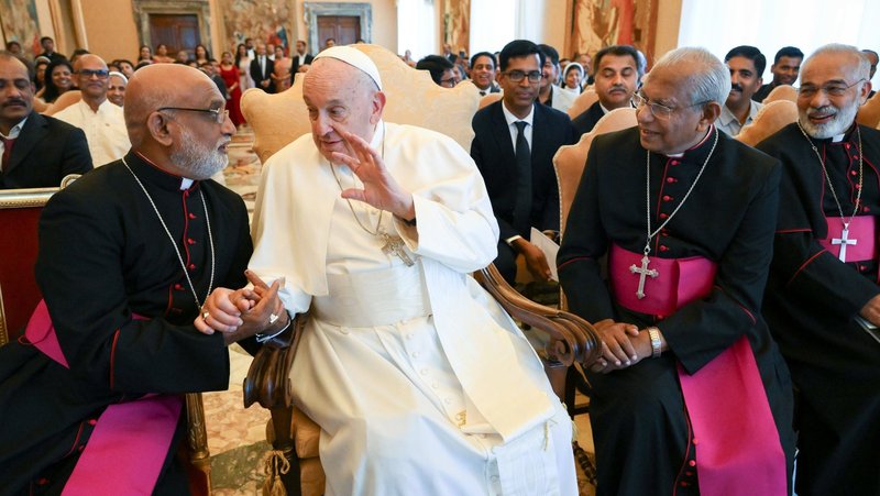 Pope Francis shakes hands with Indian Major Archbishop Raphael Thattil of Ernakulam-Angamaly during a meeting with bishops, priests and lay faithful from the Syro-Malabar Catholic Church at the Vatican May 13, 2024. (CNS photo/Vatican Media)
