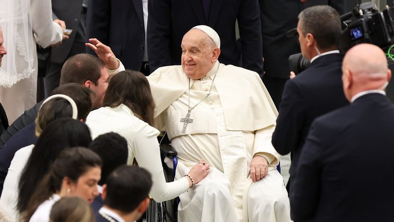 Pope Francis greets newlyweds at the conclusion of his weekly general audience in the Paul VI Audience Hall at the Vatican Jan. 8, 2025. (CNS photo/Lola Gomez)