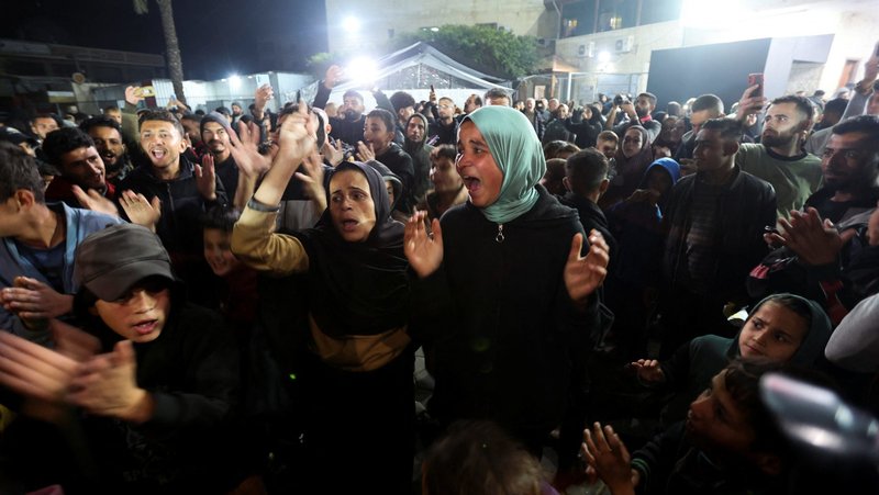Palestinians in Deir Al-Balah, in the central Gaza Strip, react to news on a Hamas ceasefire deal with Israel Jan. 15, 2025. (OSV News photo/Ramadan Abed, Reuters)