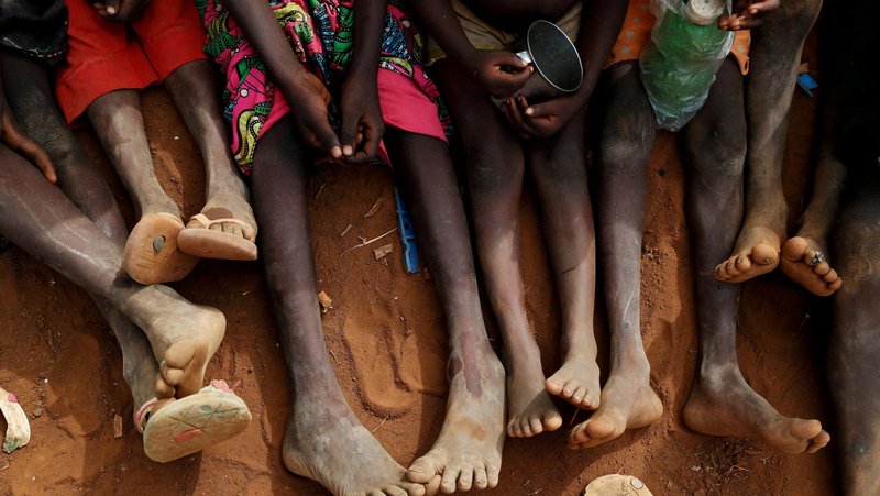 Orphans and children separated from their parents in Kadugli gather June 22, 2024, to eat boiled leaves at a camp for internally displaced people located within an area controlled by the Sudan People's Liberation Movement-North in the Nuba Mountains in Sudan's Boram County. (OSV News/Thomas Mukoya, Reuters)