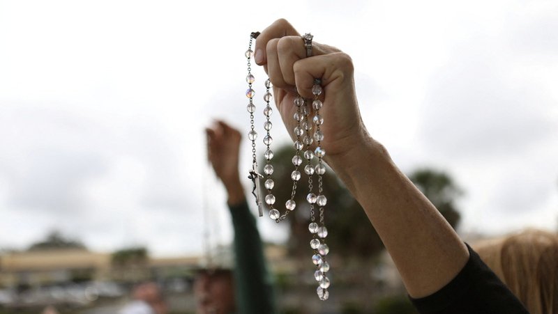 Catholic pro-life activists pray Feb. 11, 2023, outside of Bread and Roses Woman's Health Center, a Clearwater, Fla., clinic that provides abortions. A new annual report by the U.S. Conference of Catholic Bishops issued Jan. 16, 2025, identified what it called five areas of critical concern, defined as both threats and opportunities, for religious liberty. (OSV News photo/Octavio Jones, Reuters)