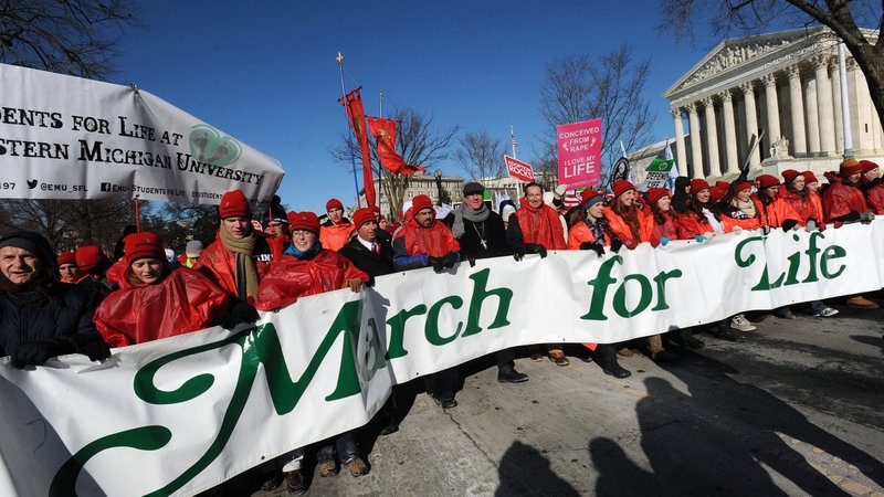 March for Life participants are pictured in a file photo carrying a banner past the front of the U.S. Supreme Court building in Washington. (OSV News photo/Leslie Kossoff)