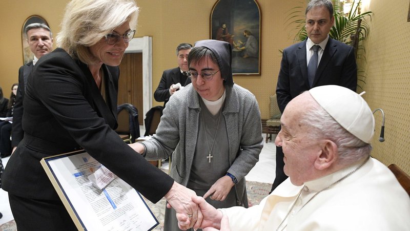 Pope Francis shakes hands with Linda Hilton, chair of the board of directors of the Conrad Hilton Foundation, during an audience with the foundation at the Vatican Jan. 22, 2025. Standing with her is Salesian Sister Alessandra Smerilli, secretary of the Dicastery for Promoting Integral Human Development. (CNS photo/Vatican Media)