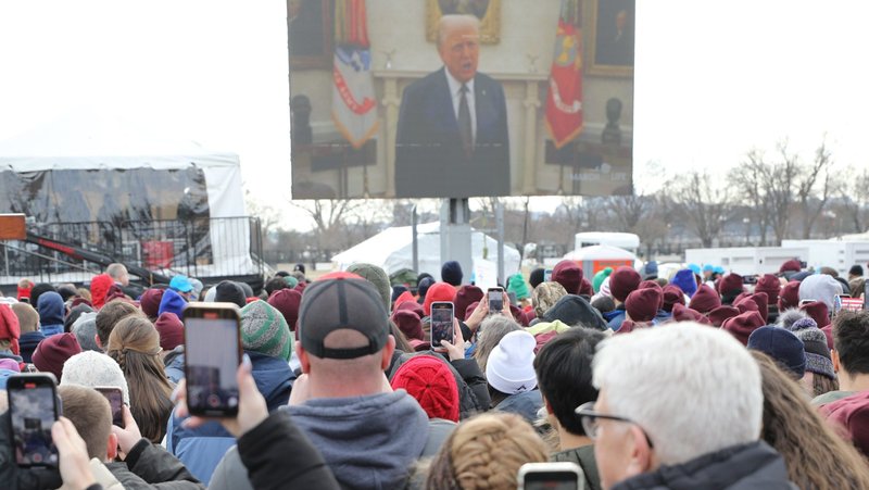 People take cellphone photos as U.S. President Donald Trump is projected on a screen during the 52nd annual March for Life rally in Washington Jan. 24, 2025. That day, Trump used his executive authority to signed to measures to prevent the use of U.S. public funding for abortion at home and overseas. (OSV News photo/Bob Roller).