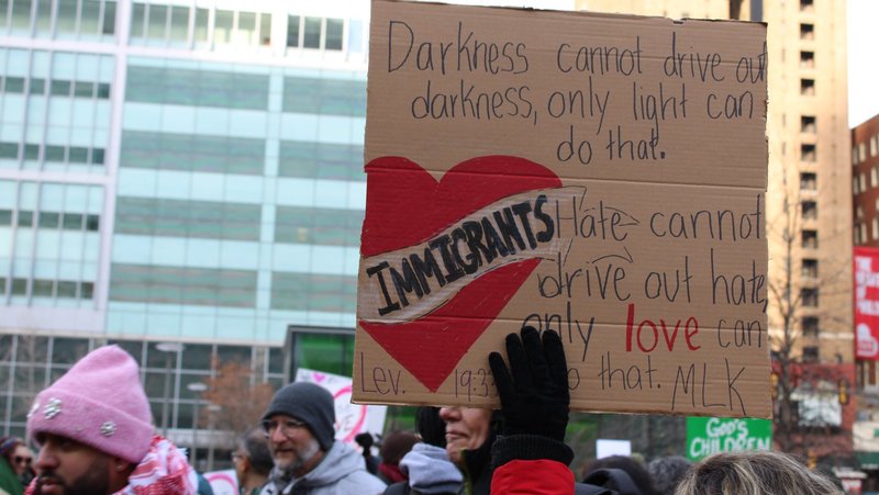 A participant holds a sign during a Jan. 25, 2025, interfaith rally in support of immigrants at Love Park in downtown Philadelphia. The event, organized by nonprofit New Sanctuary Movement, challenged city officials to push back on Trump administration policies that restrict immigration and include plans for mass deportations of unauthorized immigrants. (OSV News photo/Gina Christian)