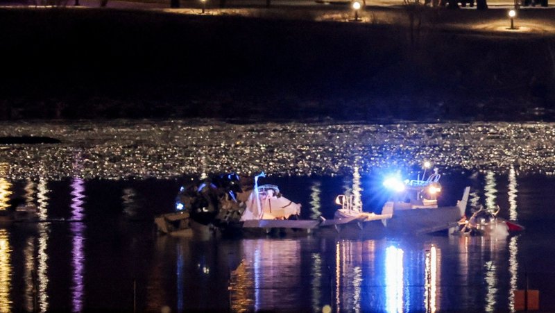 Emergency personnel and divers work Jan. 30, 2025, in a search-and-rescue mission on the Potomac River in Washington after American Eagle flight 5342 collided with a Black Hawk Army helicopter late Jan. 29 while on approach to Ronald Reagan Washington National Airport for landing and crashed into the river. Sixty passengers and four crew members were aboard the jet, and three soldiers were on the helicopter. (OSV News photo/Carlos Barria, Reuters)