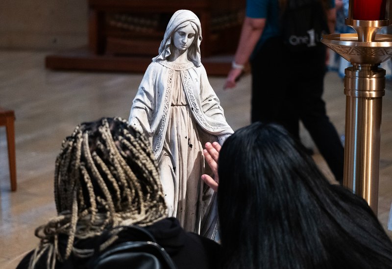Attendees venerated the Virgin Mary statue that survived the Eaton Fire during the OneLife LA celebration at the Cathedral of Our Lady of the Angels on Jan. 18. (Victor Alemán)