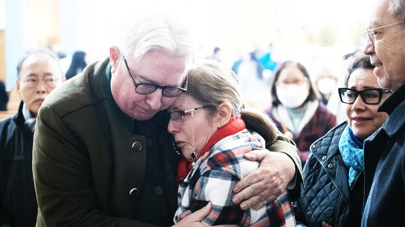 People grieve at a special Jan. 9 Mass at Mission San Gabriel for victims and first responders affected by the fires sweeping Los Angeles County. (Victor Alemán)
