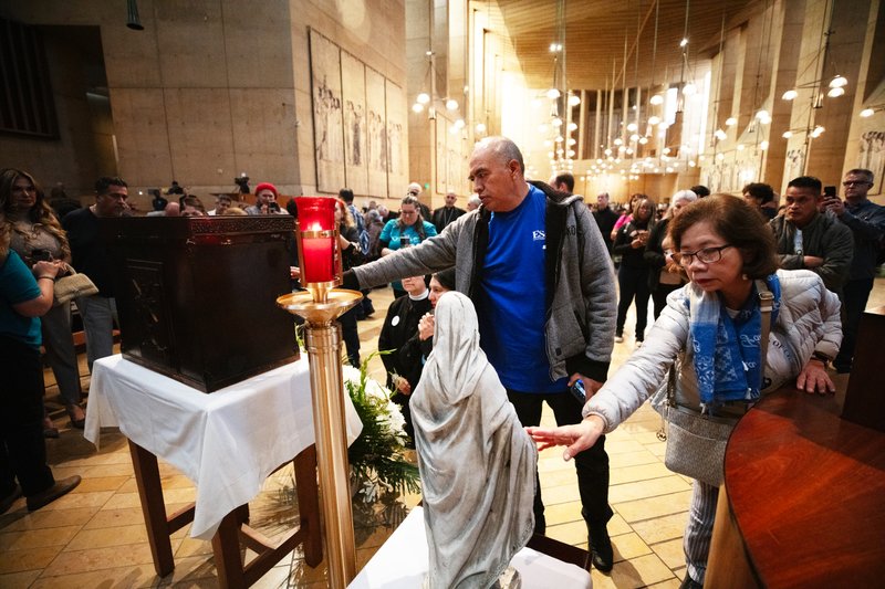 Thousands who attended the OneLife LA event on Jan. 18 venerate the Virgin Mary statue that survived the Eaton Fire and the tabernacle saved from the rubble of Corpus Christi Church in the Palisades Fire. (Victor Alemán)