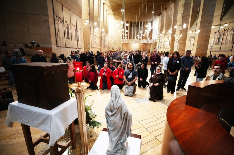 Thousands who attended the OneLife LA event on Jan. 18 venerated the Virgin Mary statue that survived the Eaton Fire and the tabernacle saved from the rubble of Corpus Christi Church in the Palisades Fire. (Victor Alemán)
