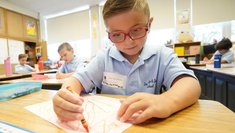 Kindergartener Niccolo Mormile uses a crayon as he works on an assignment on the first day of classes at Sts. Philip and James School in St. James, N.Y., Sept. 4, 2024. (OSV News photo/Gregory A. Shemitz)