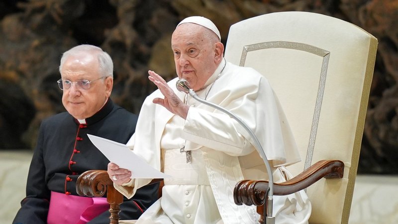 Pope Francis smiles at visitors and speaks to them in Spanish during his general audience in the Paul VI Audience Hall at the Vatican Feb. 5, 2025. (CNS photo/Lola Gomez)