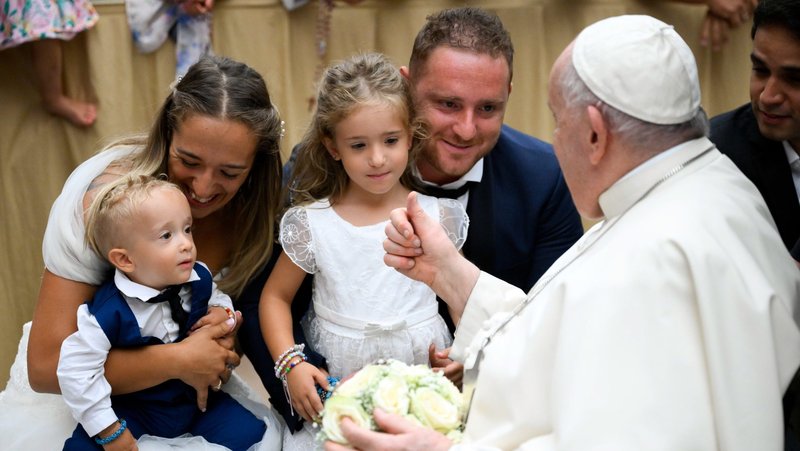 Pope Francis greets a married couple and their children at the end of his weekly general audience in the Paul VI Audience Hall at the Vatican Aug. 30, 2023. In 2025, National Marriage Week USA is celebrated Feb. 7-14 and World Marriage Day, which is commemorated on the second Sunday of February, is celebrated Feb. 9. (CNS photo/Vatican Media)
