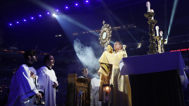 Bishop Andrew H. Cozzens of Crookston, Minn., chairman of the board of the National Eucharistic Congress Inc., blesses pilgrims July 17, 2024, during adoration at the opening revival night of the 10th National Eucharistic Congress at Lucas Oil Stadium in Indianapolis. (OSV News photo/Bob Roller)