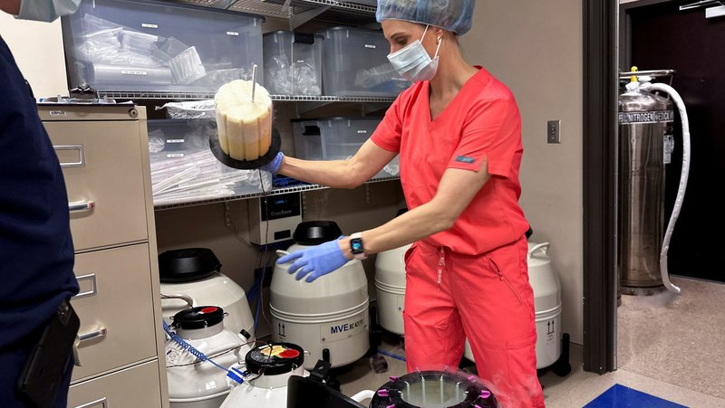 Dr. Andrew Harper, medical director for Huntsville Reproductive Medicine, P.C., looks on as Lynn Curry, nurse practitioner for Huntsville Reproductive Medicine, P.C., opens IVF cryopreservation dewar in Madison, Ala., March 4, 2024. U.S. President Donald Trump signed an executive order Feb. 19, 2025, to develop policy recommendations to expand access to and affordability of in vitro fertilization. (OSV News photo/Roselle Chen, Reuters)