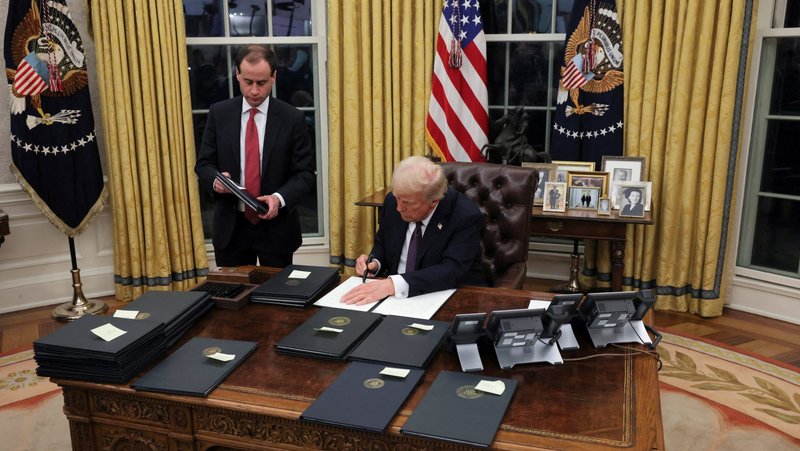U.S. President Donald Trump signs an executive order in the Oval Office of the White House, in Washington, Jan. 23, 2025. Trump signed an executive order Feb. 19, to develop policy recommendations to expand access to and affordability of in vitro fertilization. (OSV News photo/Carlos Barria, Reuters)