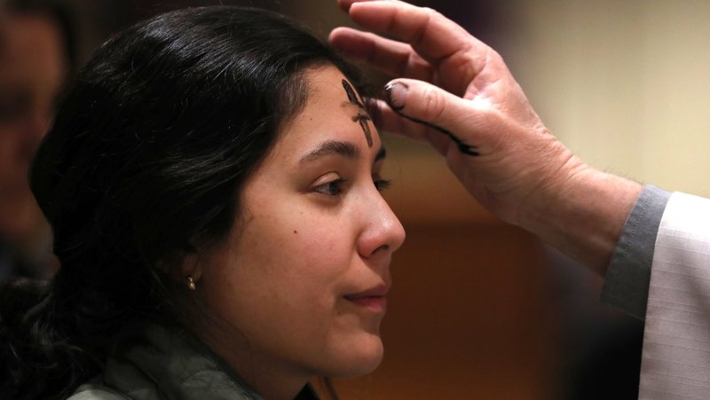 A young woman receives ashes during Ash Wednesday at Sacred Heart Church in Prescott, Ariz., Feb. 14, 2024. (OSV News photo/Bob Roller)