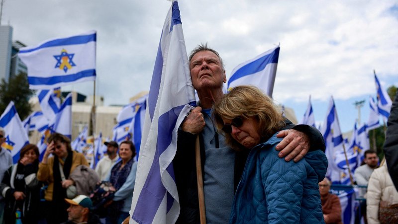 People gather in Tel Aviv, Israel, Feb. 20, 2025, on the day the bodies of deceased Israeli hostages, identified at the time by Palestinian militant groups as Oded Lifschitz, Shiri Bibas and her two children Kfir and Ariel Bibas, who were kidnapped during the deadly Oct. 7, 2023, attack by Hamas, are handed over under the terms of a ceasefire between Hamas and Israel. (OSV News photo/Ammar Awad, Reuters)