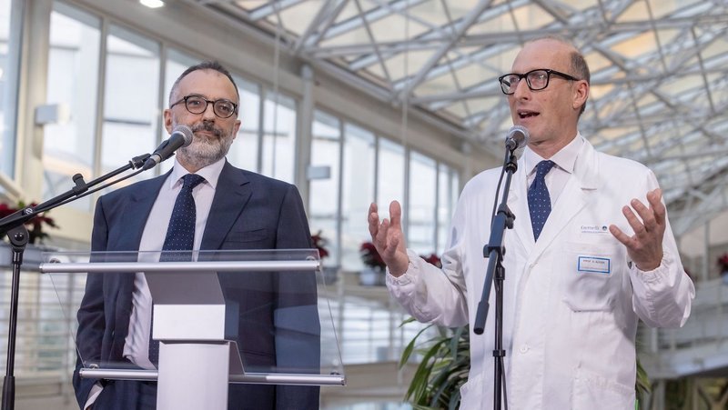 Dr. Sergio Alfieri, director of medical and surgical sciences at Rome's Gemelli hospital, speaks to the press at the hospital Feb. 21, 2025. Looking on is Dr. Luigi Carbone, Pope Francis' personal physician. (CNS photo/Pablo Esparza)