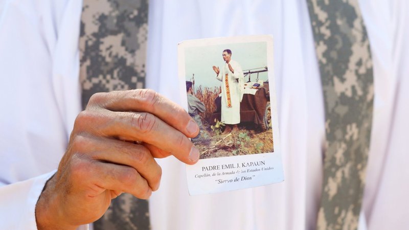 Father Ned Blick, a Catholic priest from the Diocese of Wichita, Kan., holds a prayer card of Father Emil J. Kapaun Sept. 28, 2021. While he continued treatment at Rome's Gemelli hospital, Pope Francis issued a series of decrees regarding several sainthood causes Feb. 24, 2025, including for Father Kapaun, a U.S. Army military chaplain who died in a prisoner of war camp in North Korea in 1951. The pope recognized his sacrifice as an "offering of life," a category distinct from martyrdom that the pope established in 2017. (OSV News photo/Karen Mikols Bonar)