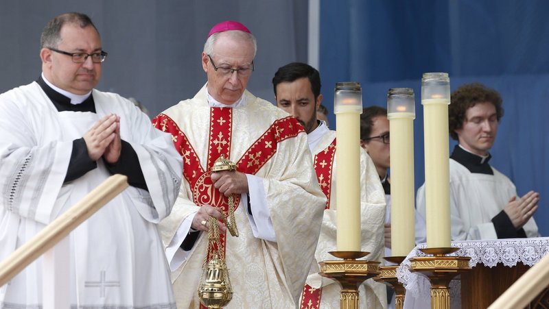 Archbishop Richard W. Smith of Edmonton, Alberta, burns incense as Pope Francis celebrates Mass at Commonwealth Stadium in Edmonton, Alberta, July 26, 2022. The Vatican announced Feb. 25, 2025, that Pope Francis has accepted the resignation of Archbishop J. Michael Miller, 75, of Vancouver, British Columbia, and appointed Archbishop Smith, 65, as his successor. (CNS photo/Paul Haring)