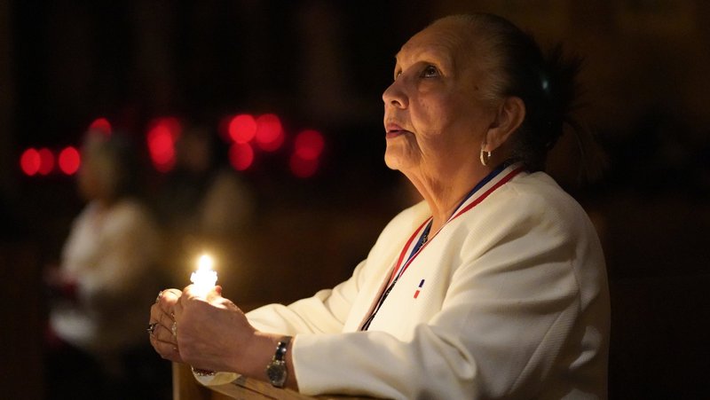 A woman prays during a Spanish-language candlelit Mass celebrated on the eve of the feast of the Presentation of the Lord, also known as Candlemas, at St. Joseph Church in the Staten Island borough of New York Feb. 1, 2025. A new study from Pew Research shows a leveling off in the decline of the number of U.S. residents identifying as Christian. (OSV News photo/Gregory A. Shemitz)