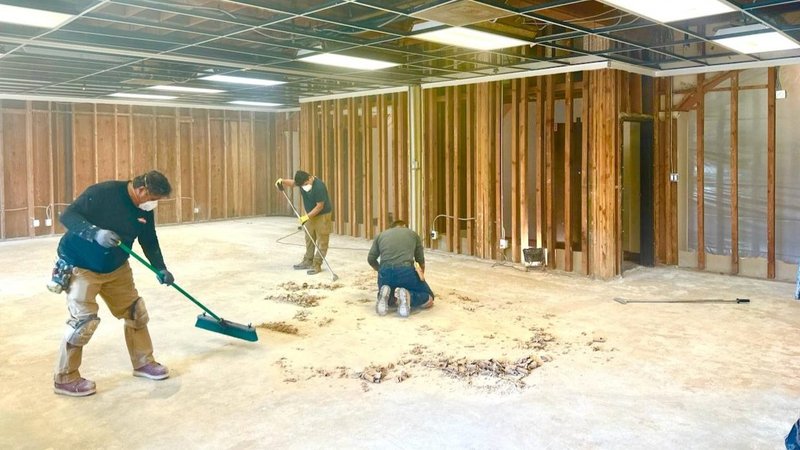 De Loor Hall, one of the damaged areas in the retreat center building, is being cleaned and partitioned from the usable part of the facility. (Father Febin Barose)