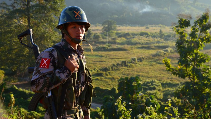 A soldier from the Kachin Independence Army (KIA) stands on lookout in 2012. (Simon Roughneen/Shutterstock)