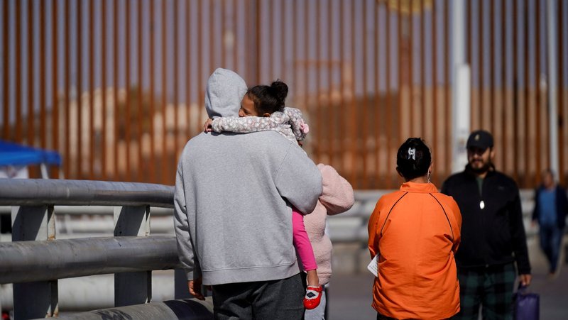 Cuban migrant Marielis Arosh and her family walk with other migrants after their CBP One app asylum appointment was canceled on the day of U.S. President Donald Trump’s inauguration, near the border fence in Mexicali, Mexico, Jan. 20. (OSV News/Victor Medina, Reuters)