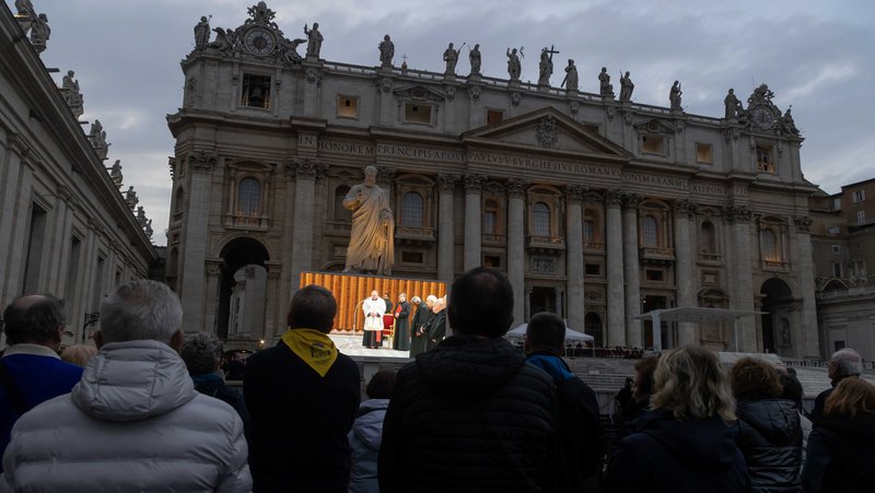 People in St. Peter's Square at the Vatican pray the rosary for Pope Francis led by Cardinal Kevin J. Farrell, prefect of the Dicastery for Laity, the Family and Life, March 10, 2025. Cardinal Farrell and other senior Vatican officials, who are on their Lenten retreat, prayed the rosary in the Vatican audience hall while people in the square watched on video screens. (CNS photo/Pablo Esparza)