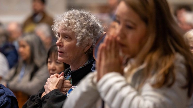 Women pray during a Mass with Holy Year pilgrims from the Diocese of Pittsburgh, the Diocese of San Bernardino, Calif., and St. Agnes School in St. Paul, Minn., at the Altar of the Chair in St. Peter's Basilica at the Vatican March 17, 2025. (CNS photo/Pablo Esparza)