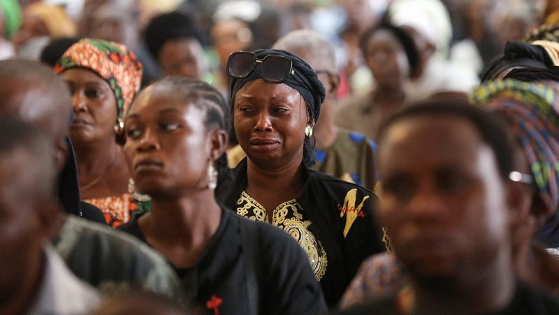 A woman cries during a funeral Mass in the the parish hall of St. Francis Xavier Church in Owo, Nigeria, June 17, 2022, for at least 50 victims killed in a June 5 attack by gunmen. In the West African country, seminarian Andrew Peter, 21, has become the latest victim of killings there. On March 3, 2025, he was kidnapped alongside Father Philip Ekweli, a priest from the Diocese of Auchi in southern Nigeria. The priest was released March 13, but the abductors killed the seminarian, the diocese said. (OSV News photo/Temilade Adelaja, Reuters)