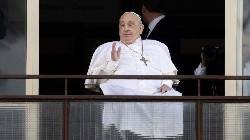 Pope Francis waves to a crowd of well-wishers at Rome's Gemelli hospital before returning to the Vatican March 23, 2025, after 38 days of treatment at the hospital. (CNS/Pablo Esparza)