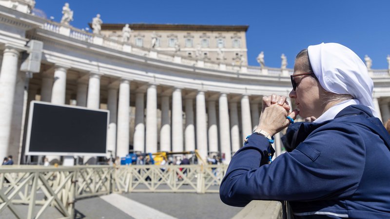 A nun prays in St. Peter's Square at the Vatican March 30, 2025. Pope Francis did not pray the Angelus in the square because he is following doctors' orders to rest. The Vatican released a written message from the pope to accompany the Angelus. (CNS photo/Pablo Esparza)