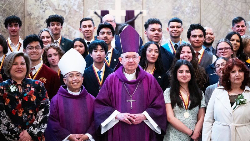 Many of the nine teachers and 72 students honored during the 2025 Christian Service Awards Mass pose with Archbishop José H. Gomez and Auxiliary Bishop Brian Nunes after the event on March 18. (Victor Alemán)
