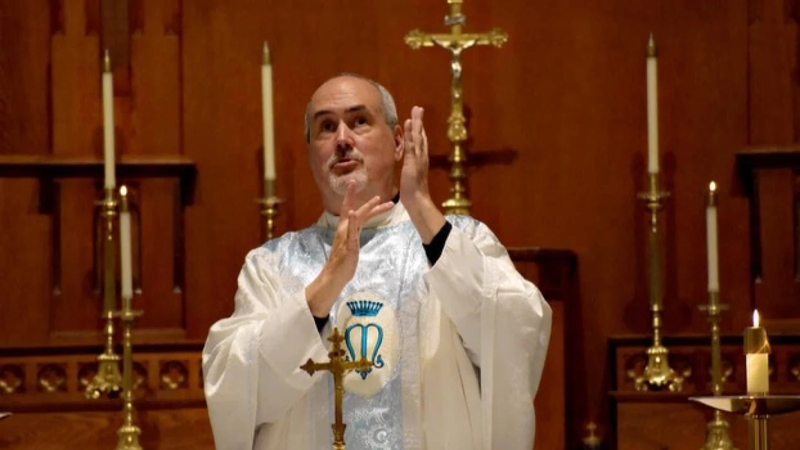 Father Mike Depcik, one of the few Deaf priests in the world, signs a Catholic Mass in American Sign Language. (Photo courtesy of Father Mike Depcik)