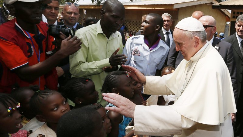 Pope Francis greets children as he visits a refugee camp in Bangui, Central African Republic, Nov. 29, 2015. (CNS photo/Paul Haring)