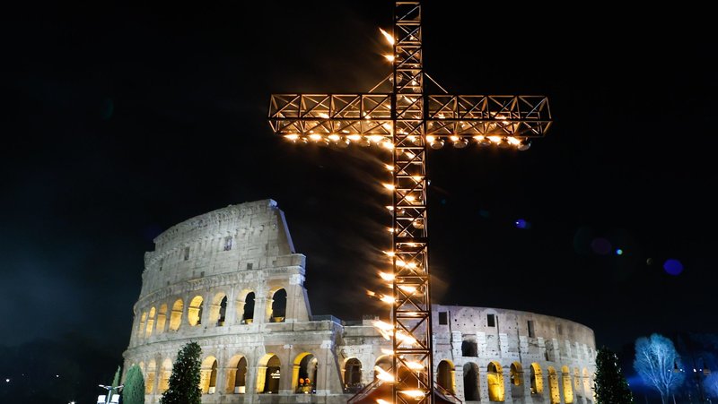 A large illuminated cross is displayed before the start of the Way of the Cross outside the Colosseum in Rome March 29, 2024. (CNS photo/Lola Gomez)