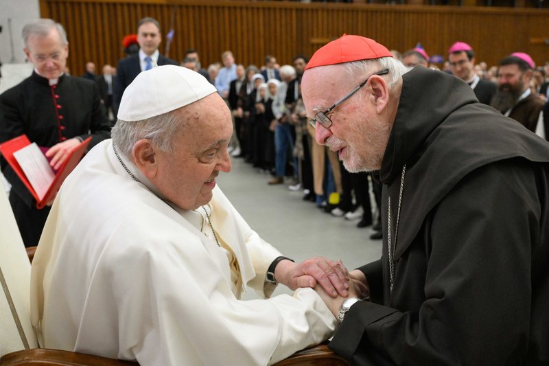Pope greets Cardinal Anders Arborelius of Stockholm, Sweden, during a meeting with a pilgrimage group from Scandinavia in the Paul VI Audience Hall at the Vatican Feb. 3, 2025. (CNS photo/Vatican Media)